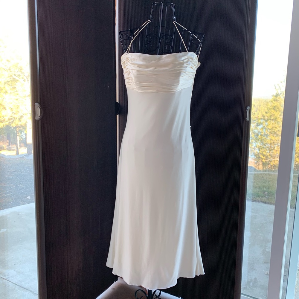 Evening / cocktail dress with interlaced back.
